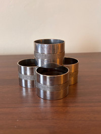 2 Sets of 4 Napkin Rings , One in Brass One in Silver