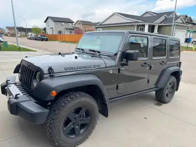 Selling my 2017 Jeep Wrangler Unlimited Sport (Big Bear Package). 141,000 km – Granite Crystal Metal...