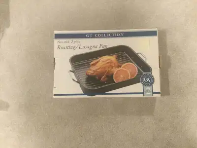 16 1/2” x 12” x 2 3/4” steel roasting pan Sturdy handles, rack included In box, never used For roast...