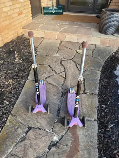 2 X Kids Scooters "Kick" Brand, Adjustable Height, Foot Brake at Back, Lean to Steer. $30 each.