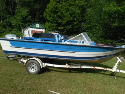 19 FOOT STARCRAFT ALUMINUM FISHING BOAT WITH STRONG EZ TRAILER HUGE WHEELS WITH A 65 HORSE EVINRUDE...