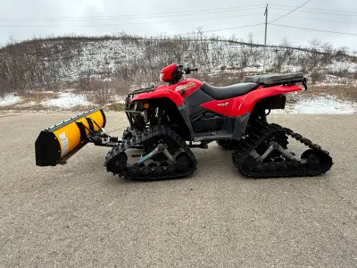 2006 Suzuki KingQuad 700 with only 1,051 miles. Comes with Tatou 4S tracks, full set of Bear Claw ti...