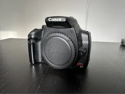 Rebel XT DSLR camera body and battery No lens or charger included