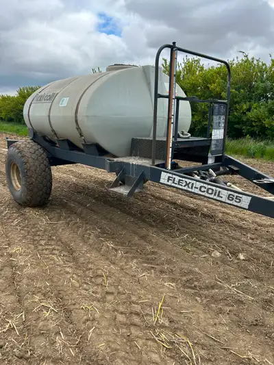 Flexi-coil sprayer tank. 1000 us gal. Tires next to new. Was used as alpine tank behind air drill. G...