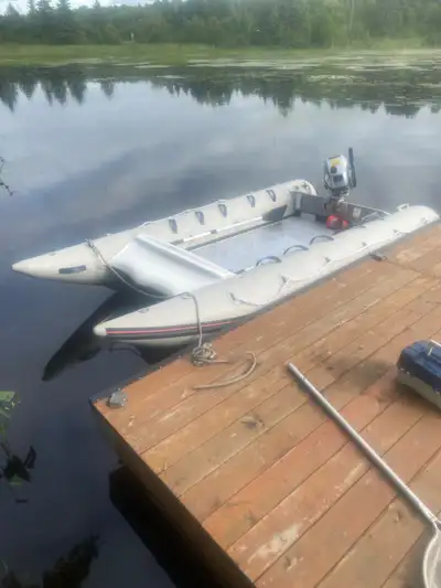 2022 Honda 5hp outboard and 2001 Zodiac-style inflatable 12’ boat. Holds 550KG or 1200lbs including...