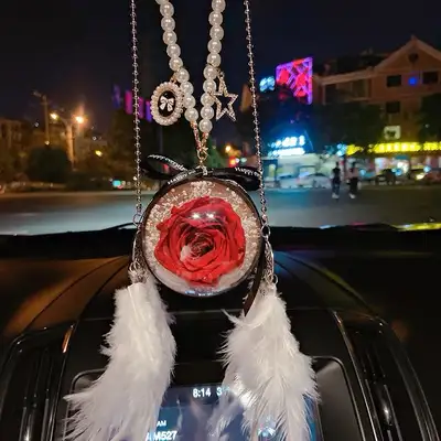 Add a touch of whimsy to your ride with this brand new car pendant featuring a preserved flower! Thi...