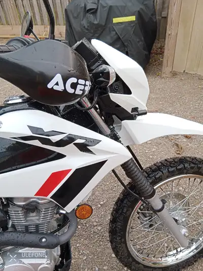 This bike is set up as a dual sport and and looks and feels like new. It is the street legal version...