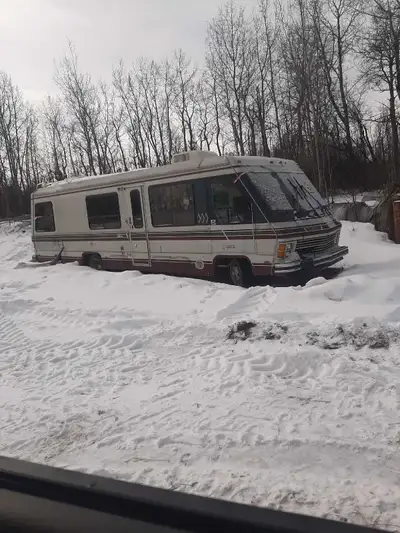 This motorhome, equipped with a running 454 engine, is available for parts. As you can see, it is in...