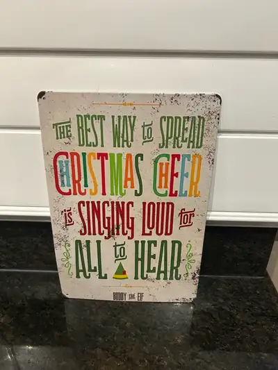 Buddy the Elf Metal Sign 12 x 8 new $15.00 (has a mark on the back) Pick up in South Windsor near Wa...