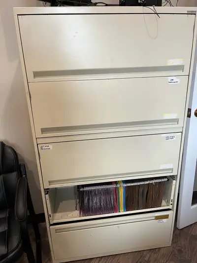 Two large (64” tall and 36” wide) filing cabinets to give away. One is missing a door as seen in the...