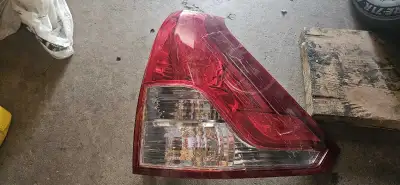 Right side rear tail light assy with crack but taped to stop leak.
