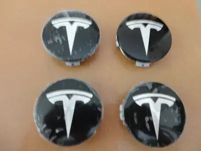 4 Tesla Center Caps, black, 2 1/4" diameter, part no. 6005879 00-A, brand new, never used, see pix o...