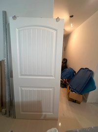 Two (2) white interior sliding doors