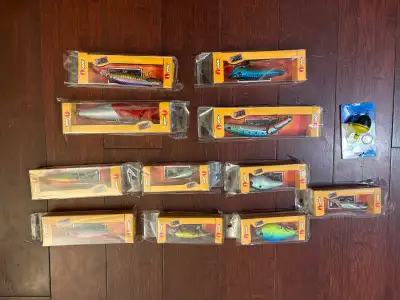 11 new in box VMC fishing lures and an LED light bobber. Lures made by the Rapala company. Mixture o...