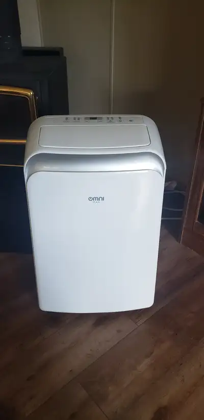 12000 btu portable air conditioner with remote. Works well comes with window hardware as well.