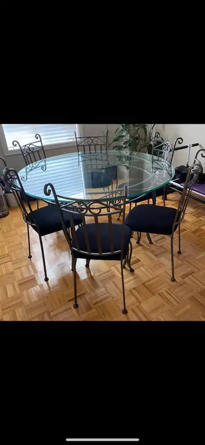GLASS & WROUGHT IRON TABLE W/ 6 CHAIRS EXCELLENT CONDITION $349 Serious inquiries only pls. Thank yo...
