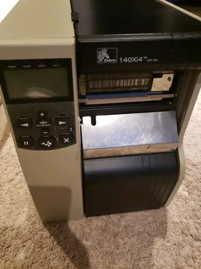 Zebra 140Xi4 203DPI thermal label printer with rewind.