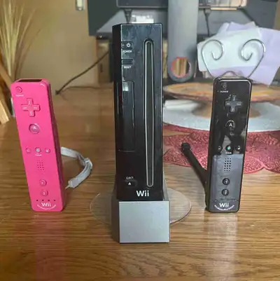 Black Wii, 2 remotes, sensor bar and all cords great condition, $75 obo.