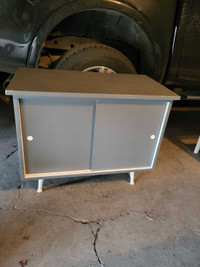 Grey Wooden Cabinet with Sliding Doors W30" D15" H 24" $60.00