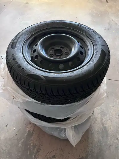 Selling a set of used WestLake winter tires mounted on steel rims, size 195/65R15 91H. These tires h...