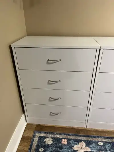 4 drawer white wooden dressers $150 for both or $100 each 28Lx16Wx36H The one dresser drawer on the...