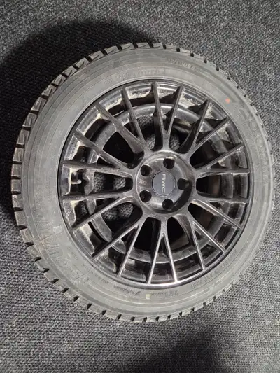 Get ready for winter with this set of Yokohama IceGuard iG51 winter tires mounted on stylish black R...