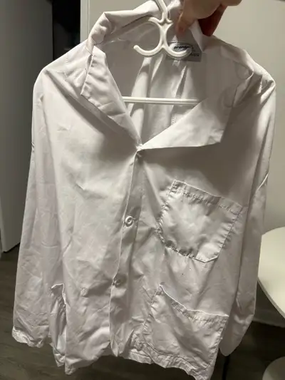 This is a Premium Uniforms lab coat in size 2XL, made of 65% polyester and 35% cotton. It is in used...