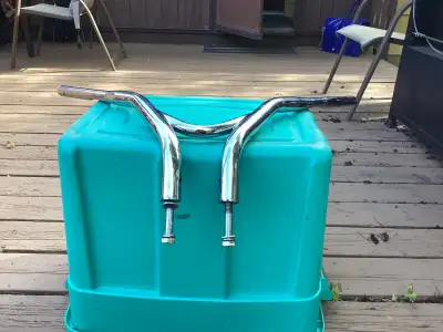 Came off Vulcan 900 custom—-8” rise but very pulled back.