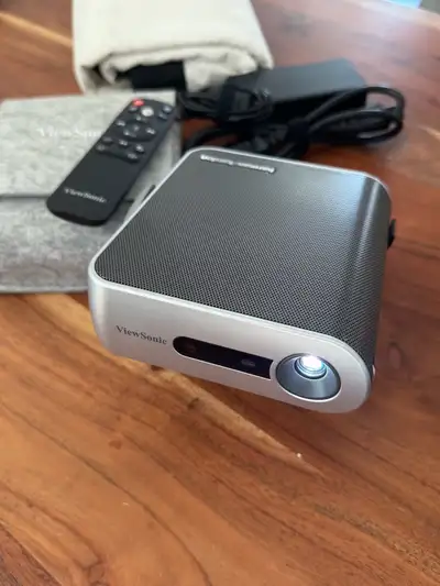 I am selling a ViewSonic M1 ultra portable projector with Harman Kardon speakers. This compact proje...