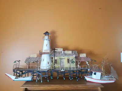 Light house with shops and boats, View more