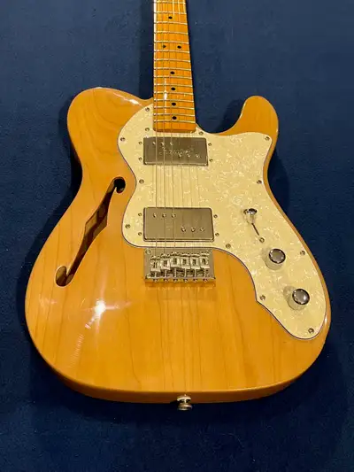 Here's a beautiful Squier '70s Thinline Telecaster that's barely been played, totally original and i...