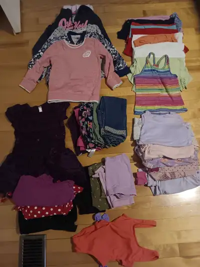 Very good used condition. Size 5T clothing, including: -4 sweaters -4 dresses - 1 swimsuit - 4 short...