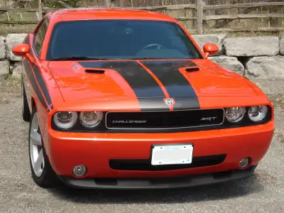The 2009 Dodge Challenger SRT8 is a high-performance muscle car that brings modern touches to a clas...