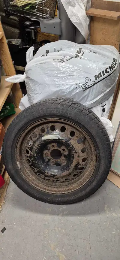 Four winter tires on rims 215 55 R17 DOT see attached photos. asking $100 Contact to make arrangemen...