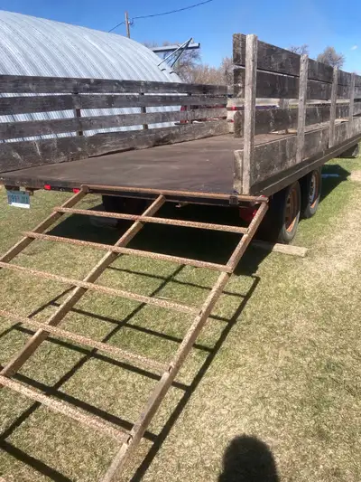 Tandem axle trailer with ramp. 8 by 16 foot steel deck. Upgraded 3500 lb axles and springs.