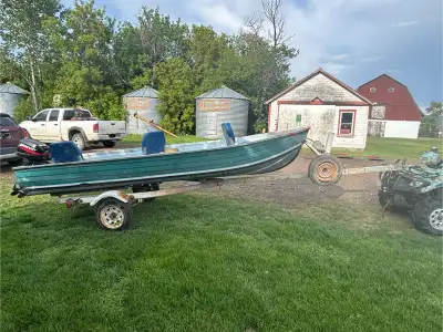 14 foot aluminum fishing boat with 15 hp mercury 2 stroke outboard motor. Comes with a yacht club bo...