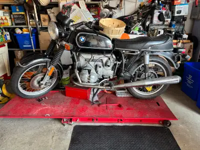 For sale is a classic 1975 BMW R90/6 motorcycle, known for its reliable air-cooled engine and vintag...
