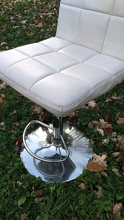 Adjustable height bar height chair, steel base, cushioned seat with vinyl covering, overall in good...