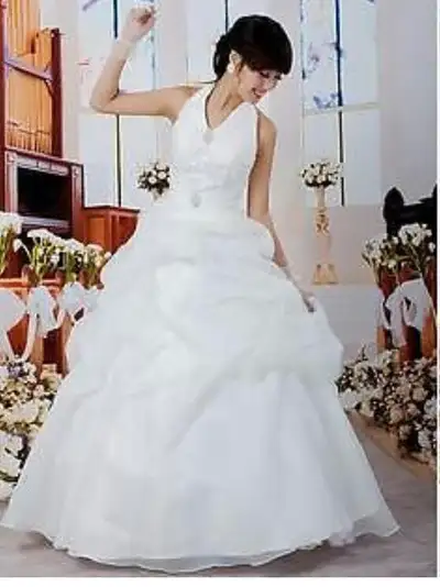 Size more to a 6-8, $300 Wedding dress and veil (not shown) good for around 100lb to115lbs. The dres...