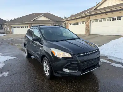 2014 Ford Eacape with 193 000 KM. New wind shield and tires recently installed Runs and drives good...