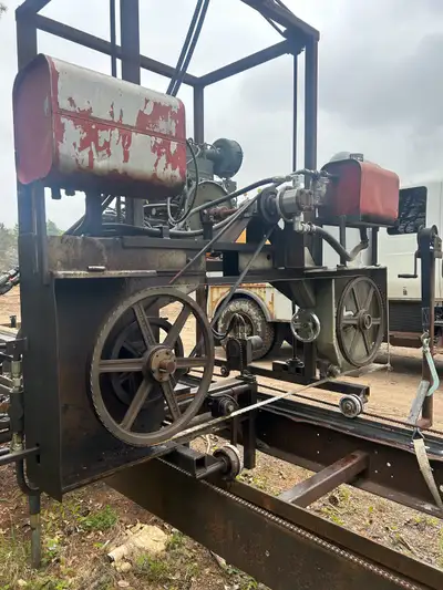Portable sawmill 36hp air cooled diesel engine with less than 100 hrs deck is 24 foot hydraulic cont...