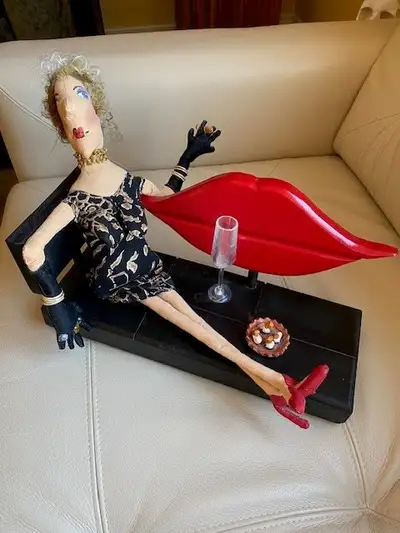 An unusual one-of-a-kind art piece. A lady of a certain age reclining while enjoying a few cigarette...