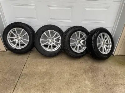 4 Firestone Winterforce tires mounted on rims with pressure sensors. F2056516 with lots of tread lef...
