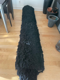 Antique black shag wool rug