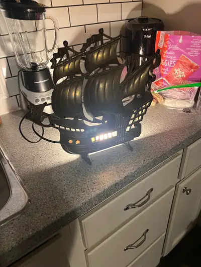 Ahoy there, mateys! Feast your eyes on this ship lamp, ready to cast a warm glow upon your humble ab...