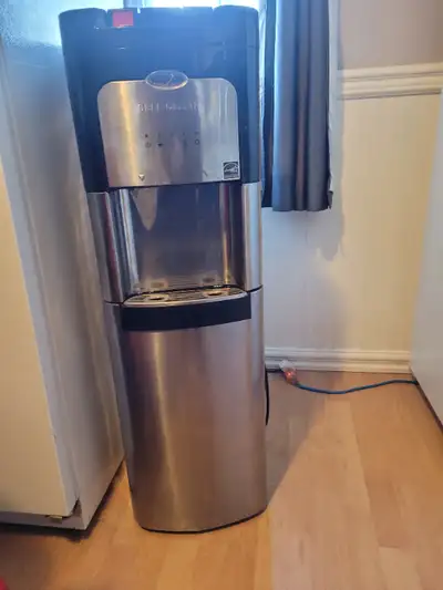 Whirl pool self clean water cooler for sale ,has a dent in side does not affect machine from working...