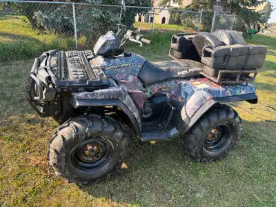 2007 sportsman 800. 4x4 Itp mud tires.3000 pound Winch. 2 up seat with storage Has foot rest for pas...