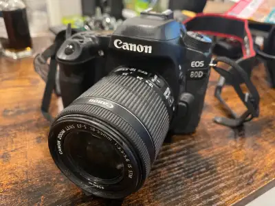 Canon EOS 80d Comes with a standard 55mm lens Roughly 5 years old or so, I used to use it for record...