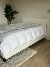Queen bed with cream faux leather headboard 