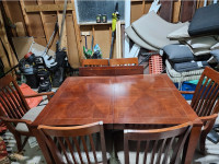 Dining room table with 6 nice chairs and expansion leaf.  $180